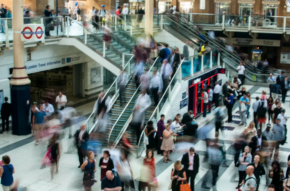 a blurred crowd on a London underground station