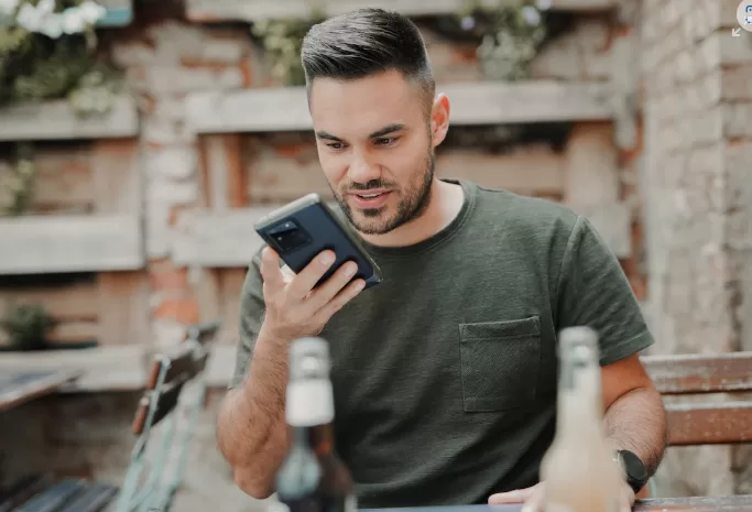 a man giving voice command to his phone