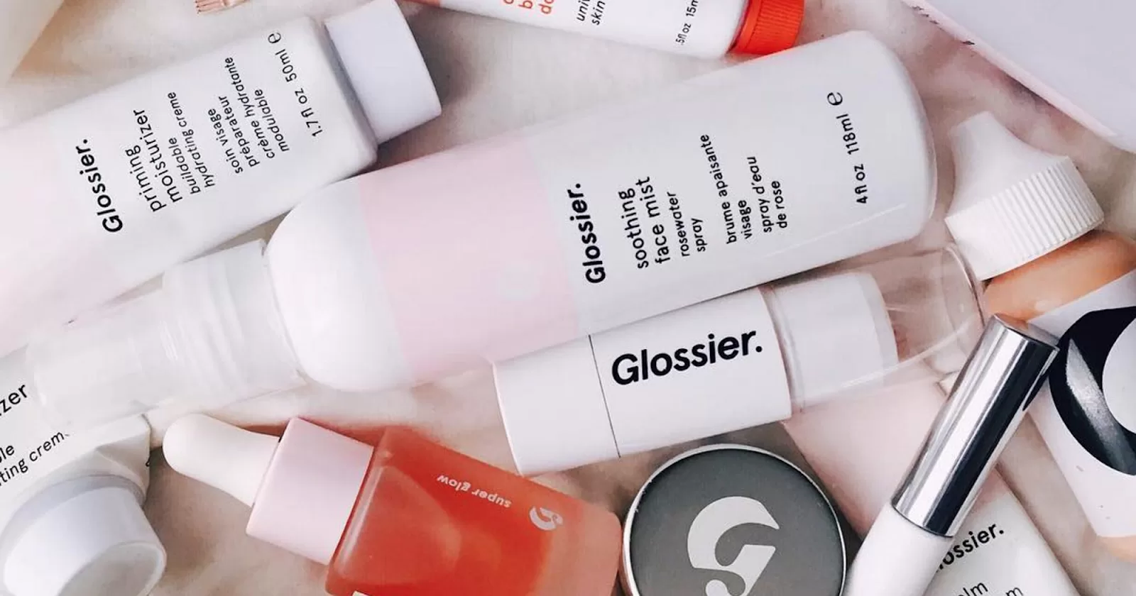 an image of several Glossier beauty products