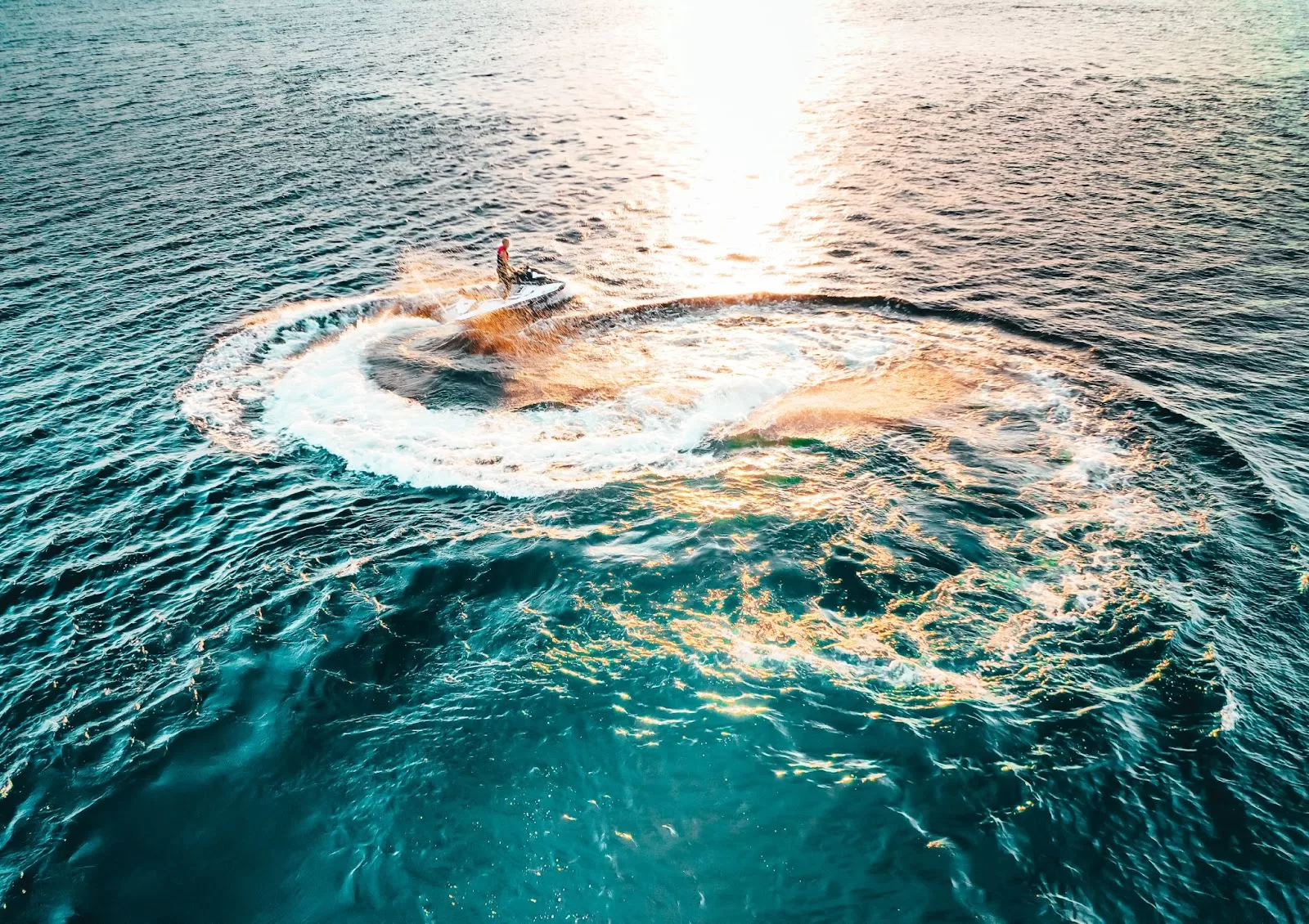 A photo of a jet ski circling in the water